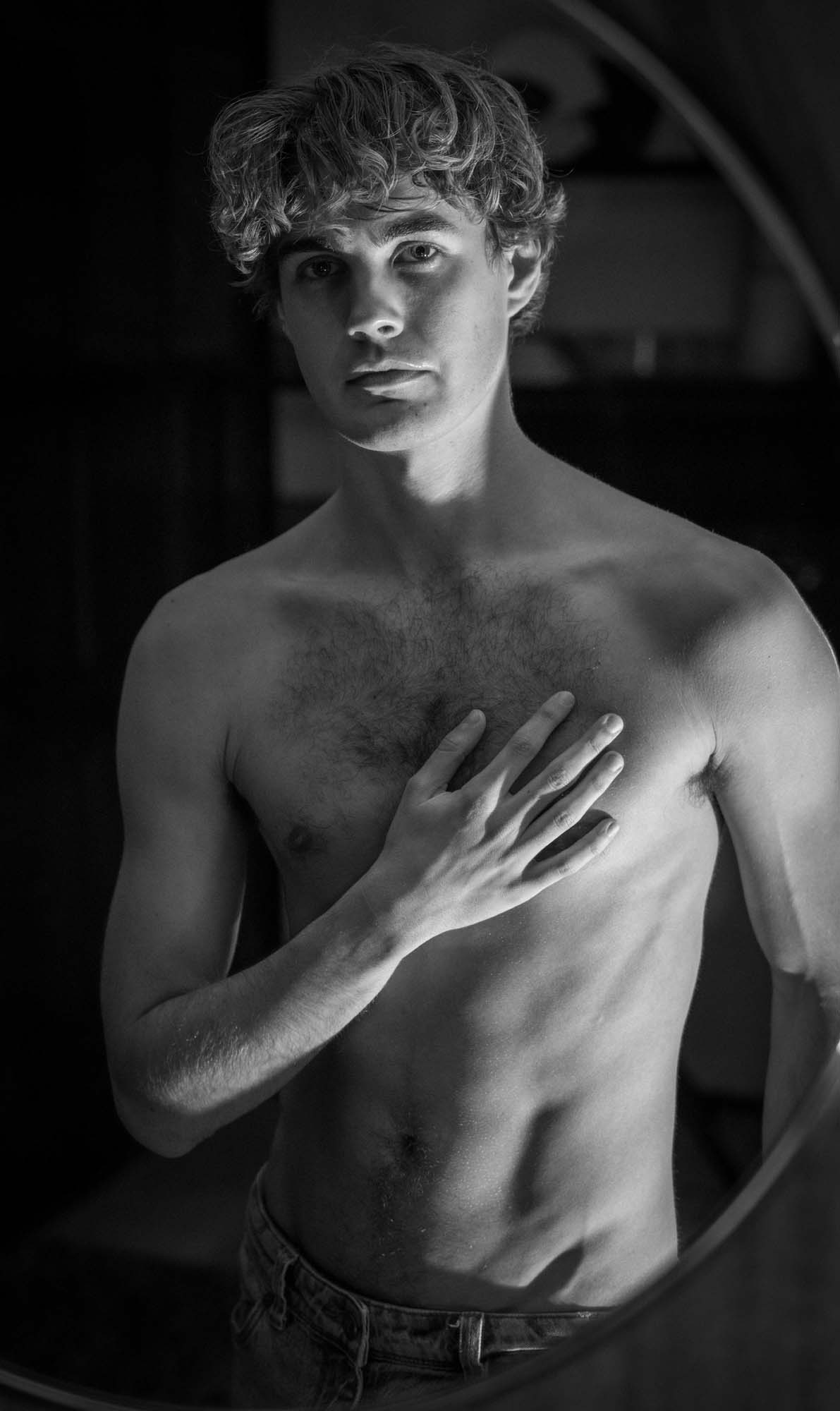 Fine art portrait - man framed in circular mirror